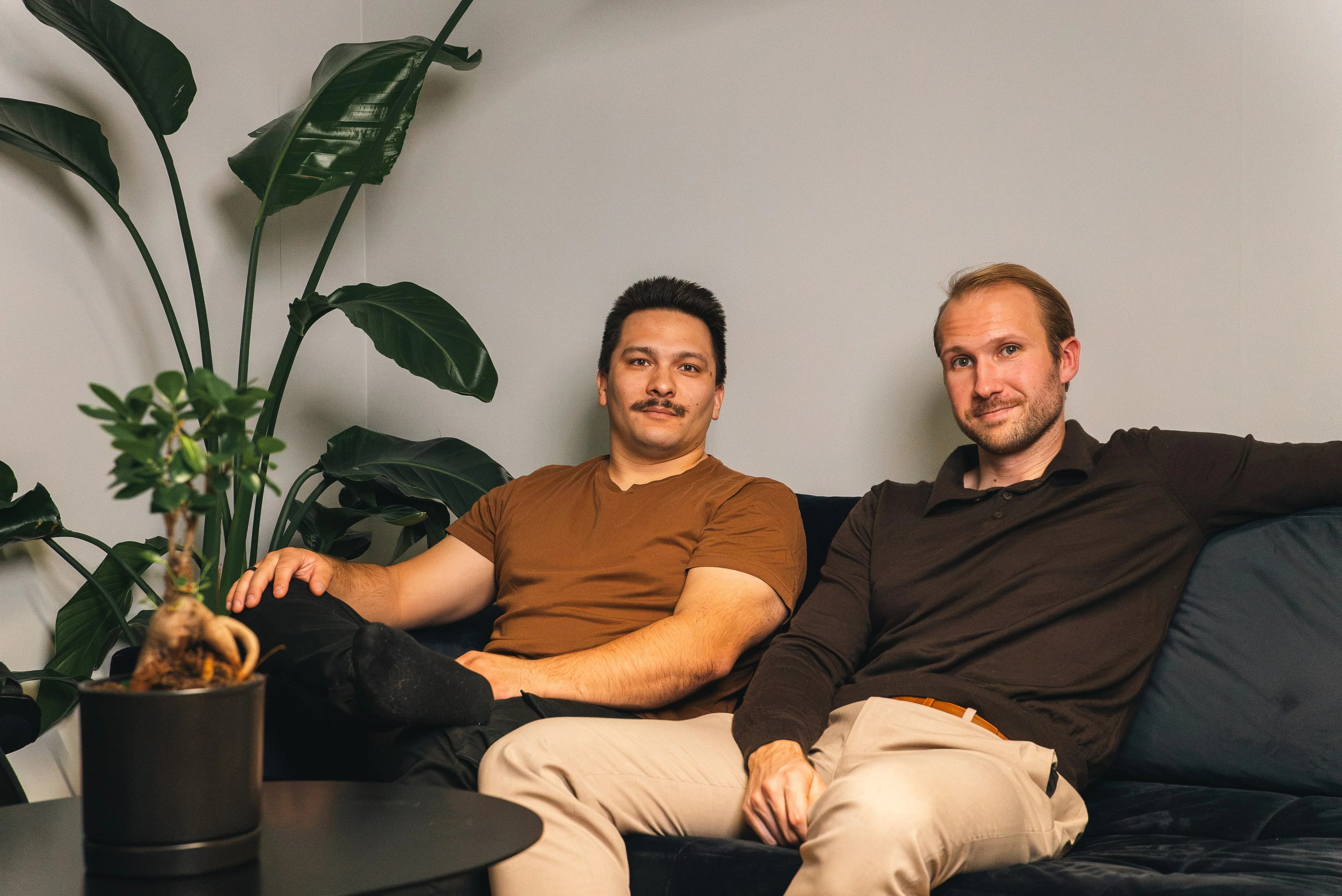 Two members of the Innovila team sitting on a sofa