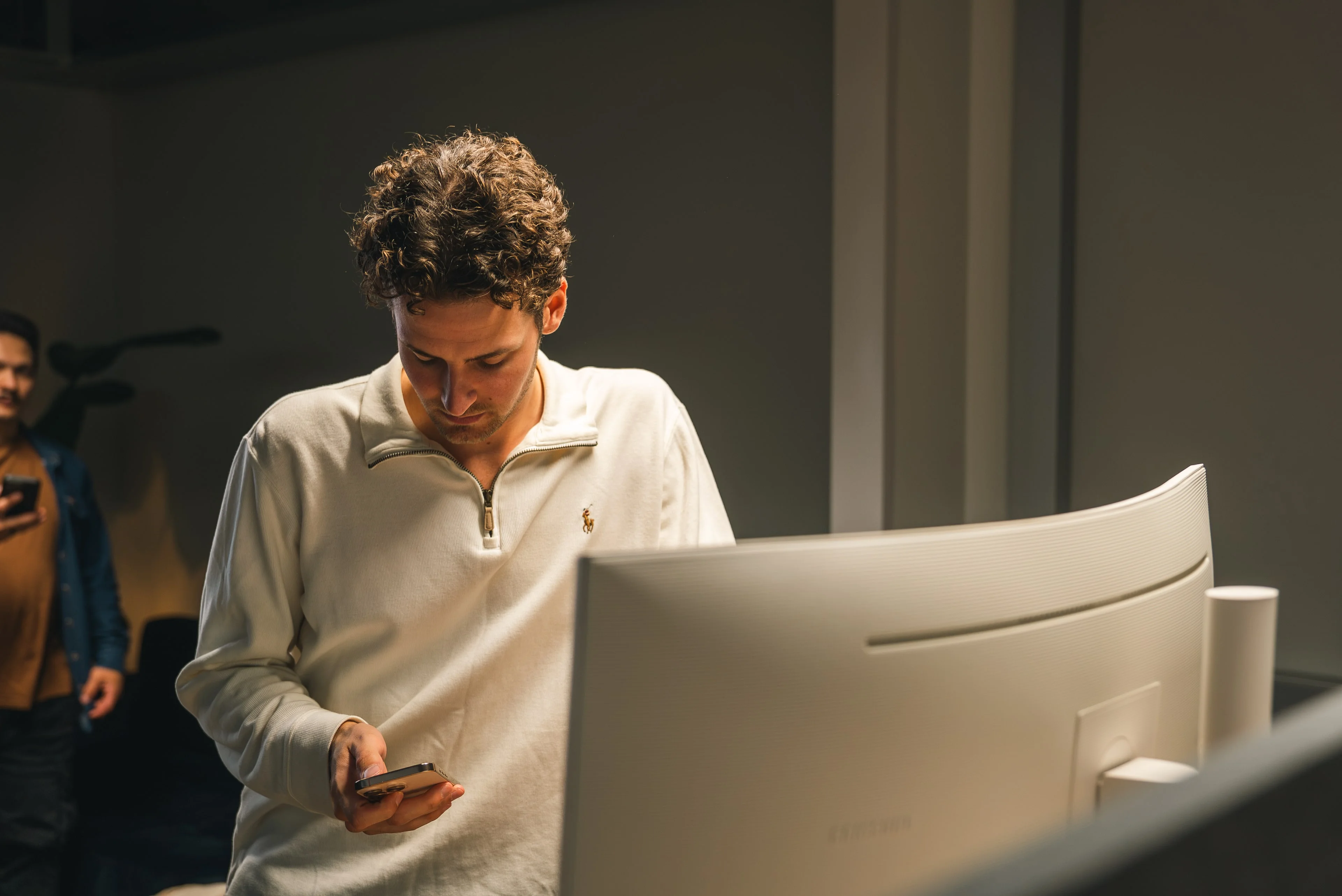 A member of the Innovila team working at a large screen