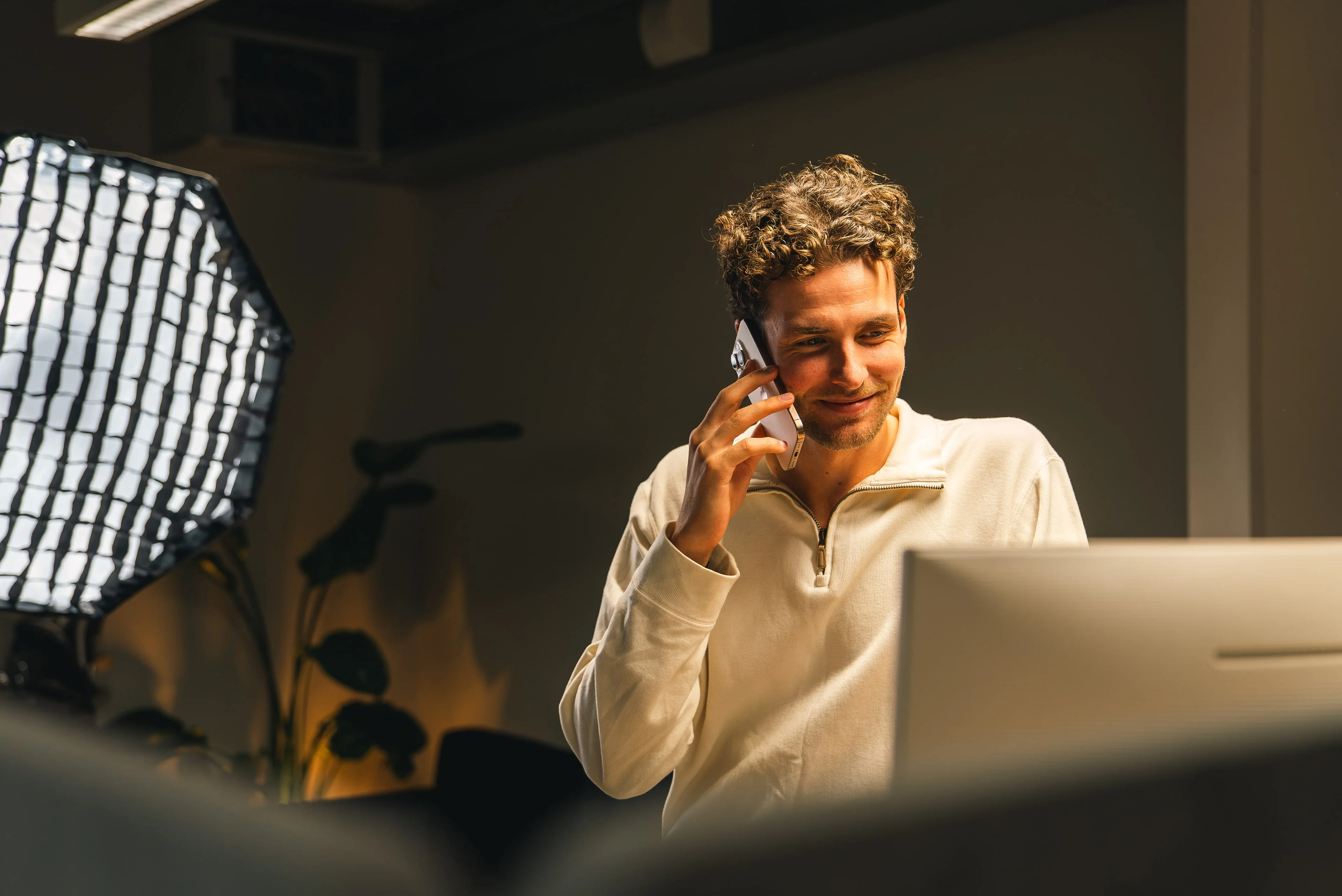 A member of the Innovila team on the phone at his computer