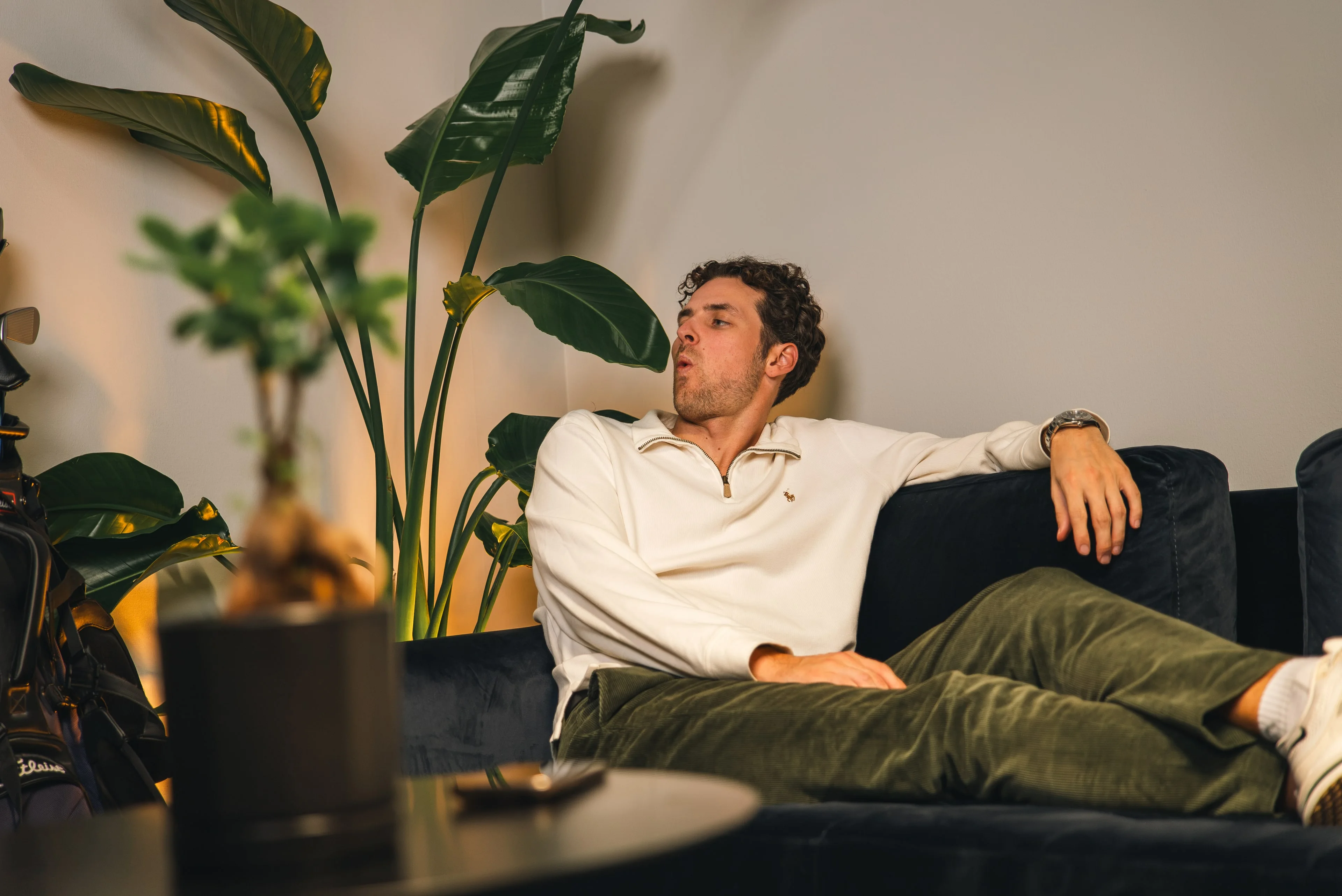 A member of the Innovila team relaxing on a sofa in the office lounge